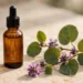 Amber glass serum bottle with dropper beside a green plant leaf