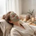 Woman applying a face mask for glowing skin