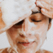 Person washing their face with a gentle foaming cleanser for oily skin