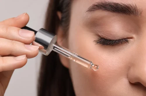Close-up of serum being applied to skin with a dropper