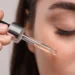 Close-up of serum being applied to skin with a dropper